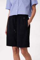 SHORT IN INTERLOCK CON CINTO ELASTICATO , BANDINE IN RASO SU FIANCHI E PENDENTE G SILVER