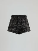 Shorts with faux leather strap