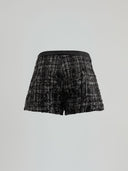 Shorts with faux leather strap