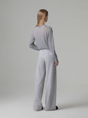 PANTALONE IN FELPA GAMBA LARGA CON PASSANTI ED ETICHETTA LOGATA SUL RETRO TASCA
