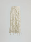 Diamond knitted skirt with logoed pendant on the front